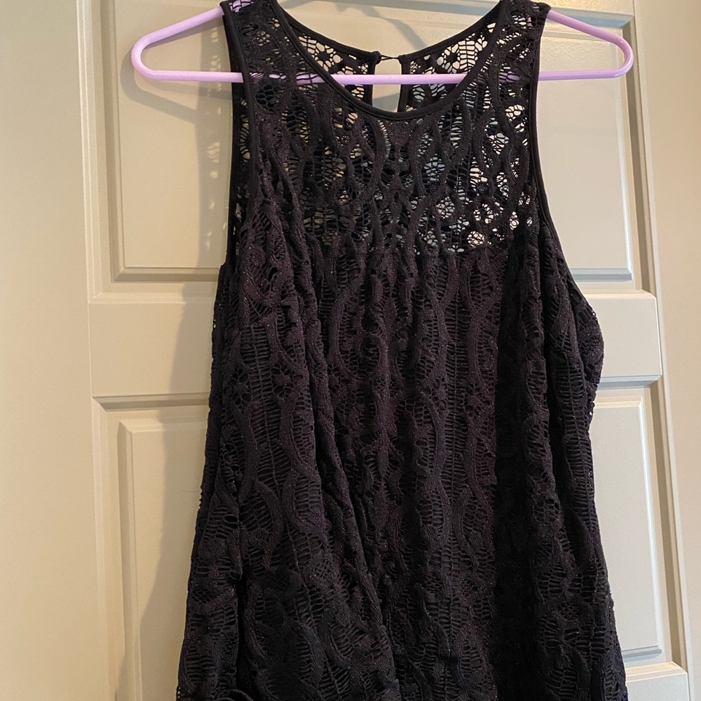Womens black sleeveless lace blouse with see through feature above bra line